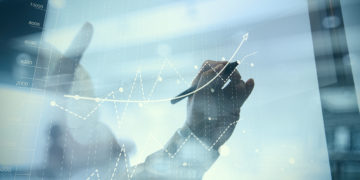 businessman hand working with new modern computer and business strategy as concept