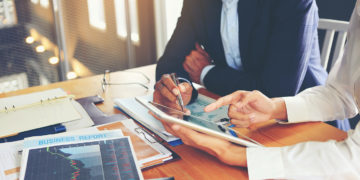 Two businessmen are consulting and planning business operations.